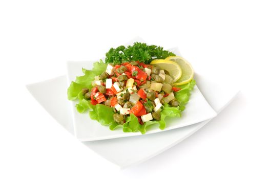 A salad of red peppers with goat cheese, capers, fresh herbs in the marinade