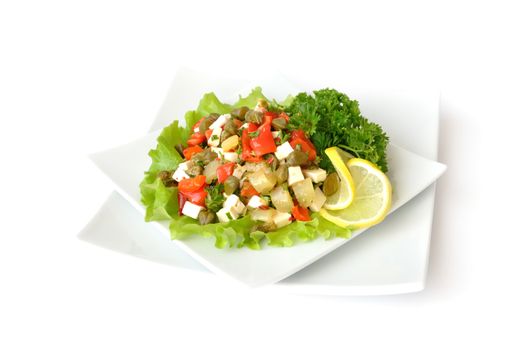 A salad of red peppers with goat cheese, capers, fresh herbs in the marinade

