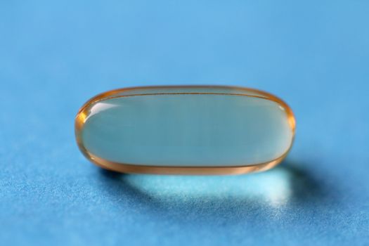 A macro shot of an Omega-3 Fish Oil Pill.