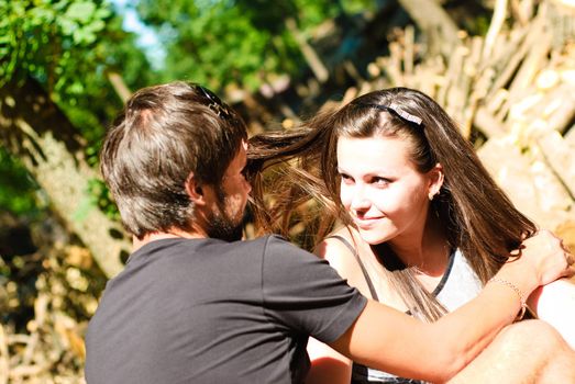 Young happy couple on the field. Shoot on the nature.