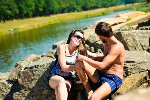 Young happy couple on the rocks. Shoot on the nature.