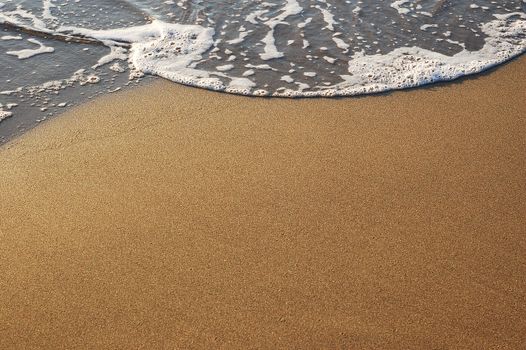 Sand and water sea foam