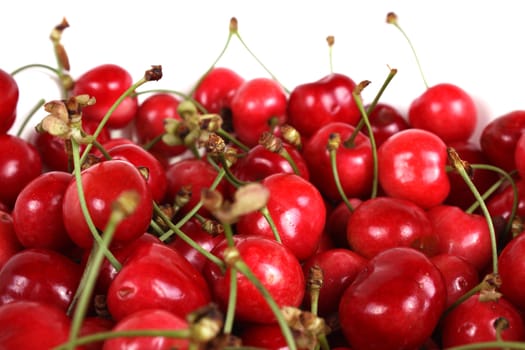 Fresh juicy red cherries isolated on white background