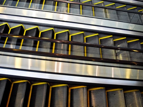 Three moving escalators with no people