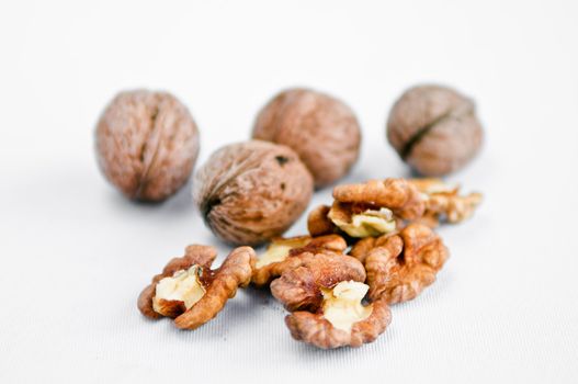 ceil and clean walnuts on white table