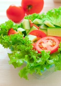 Fresh vegetables and lettuce on a plate. Picture of healthy eating