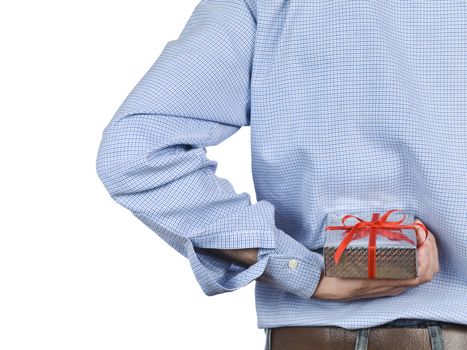 Young man hiding a gift box behind his back.