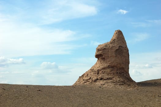 Landmarks of ruins and relics of an ancient castle in the desert which looks like Sphinx