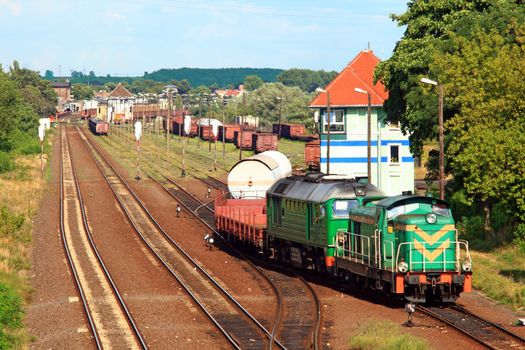 Two diesel locomotives shunting and sorting the wagons at the freight yard