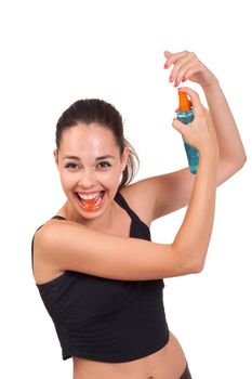 Photo of the young girl with spray posing to camera