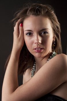 Girl in classic dress posing to the camera