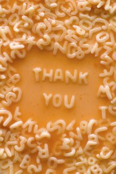 THANK YOU text made of pasta letters, ketchup tomato soup