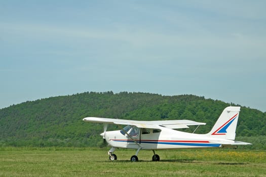 small white aeroplane preparing for take off