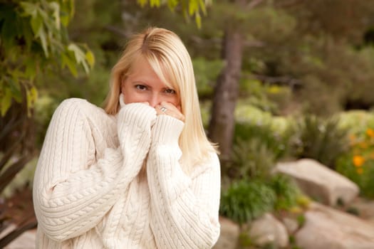 Attractive Blonde Woman Portrait in the Park.