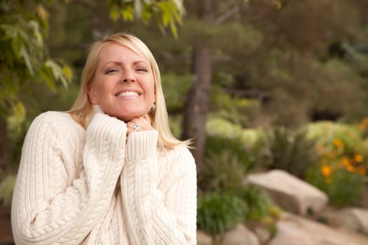 Attractive Blonde Woman Portrait in the Park.