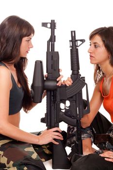 Two girls with a rifles posing to the camera