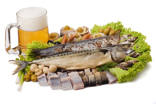 A Goblet of beer and a fish set with herring, mackerel, clupea and vegetables isolated on white