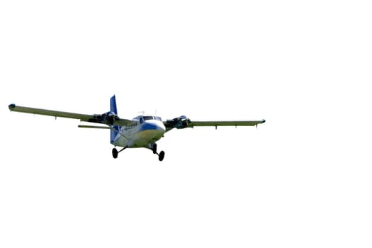 This is a medium sized twin engine propeller airplane landing on a grass landing strip. isolated on white.