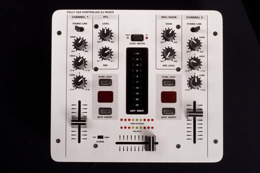 Dj mixer on a black background topview