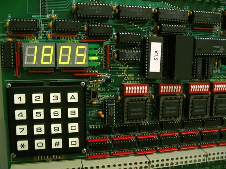 This is a lighting control panel timer and circuit board.