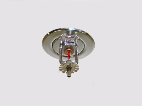 This is a building’s fire sprinkler head isolated on white.