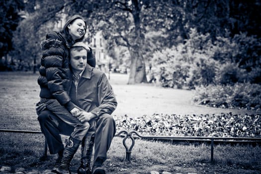 Happy young couple enjoying each other in park