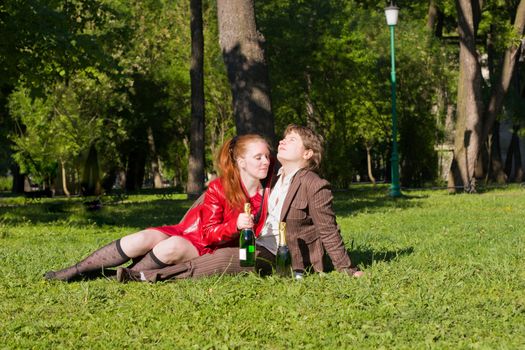 Young lesbian couple celebrating something outdoors