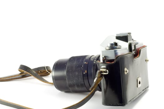 Retro photocamera in a leather case. Object over white