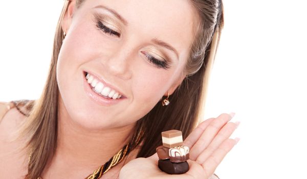 Portrait of young woman tempted by chocolate