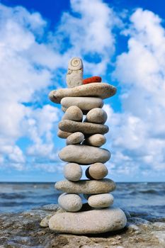 Tower of white pebble as Pagoda on the coast