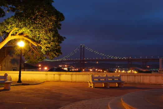 photo of April 25th Bridge, landscape of Lisbon in Portugal (after sunset)