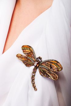 Closeup of a dragonfly made of precious stones