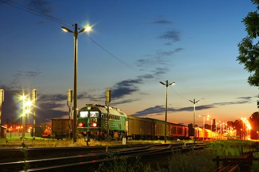 Freight train waiting at station during the evening