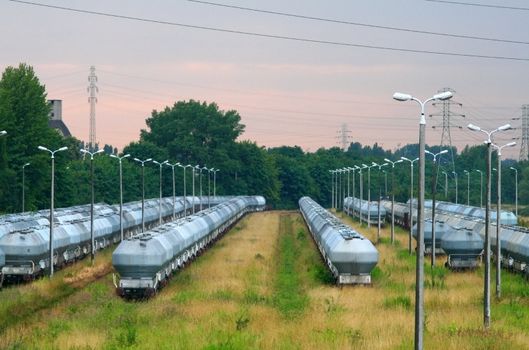 Overview of the railway freight station with lot of wagons for powdered cement