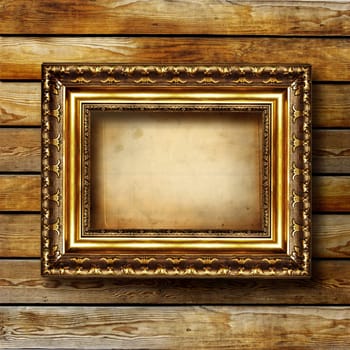 antique gilded frame over wooden wall