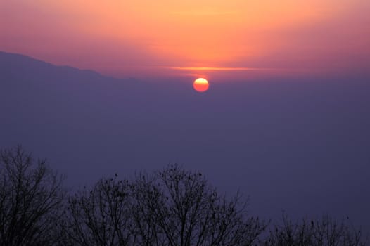 Scenery of sunset at mountains in winter