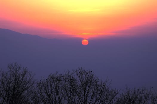 Scenery of sunset at mountains in winter
