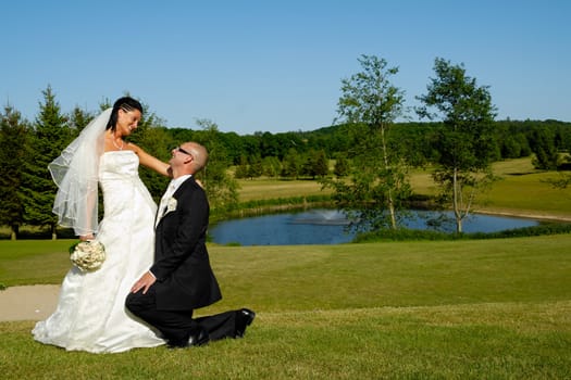 Wedding couple is looking at eachother.