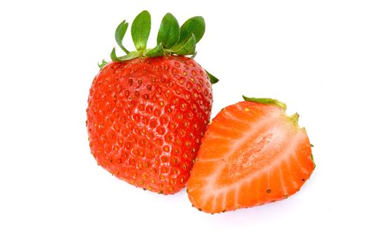 two strawberries, one cut in half, isolated on white background with clipping path