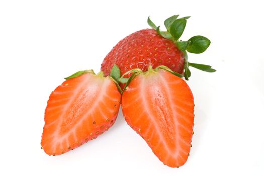 two strawberries, one cut in half, isolated on white background with clipping path