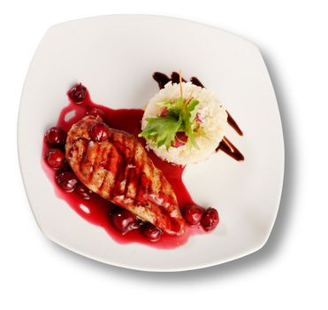 Delicious beef with cherry sauce. File includes clipping path for easy background removing