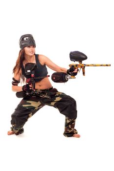 Sexy young girl posing like playing paintball