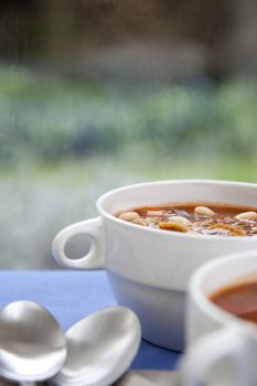 Hearty winter vegetable and white bean soup on a rainy afternoon