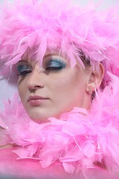 Studio shot of beatiful model with pink plumage