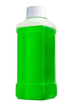 Transparent plastic bottle with green cleaning liquid. Standing vertical.
