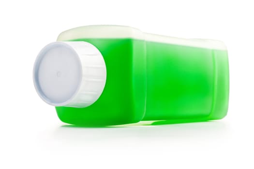 Transparent plastic bottle with green cleaning liquid. Lying horizontal.