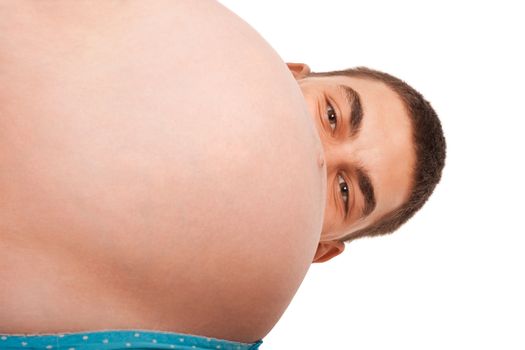 Man hiding over the belly of the pregnant woman. Studio shoot on white.