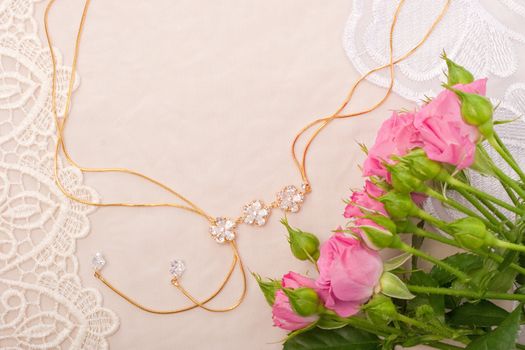 Chain and roses on lace background