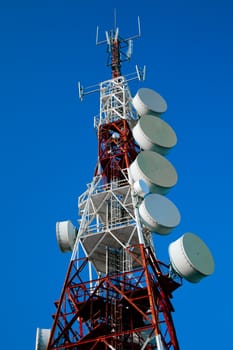Communications tower with a beautiful blue sky