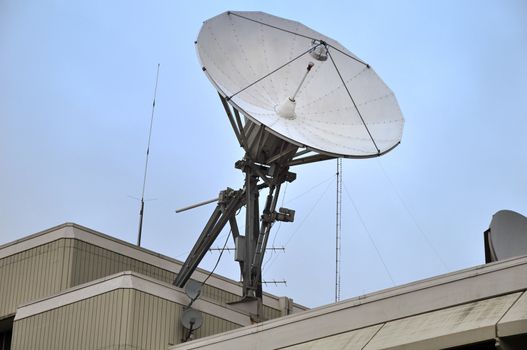 Satellite dish on the roof of the building.
